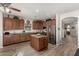 Kitchen with island, stainless steel appliances, and wood cabinets at 3829 S Harlan --, Mesa, AZ 85212