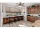 Bright kitchen features a breakfast bar and updated wood cabinets at 3829 S Harlan --, Mesa, AZ 85212