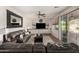 Spacious living room featuring a large TV and comfortable seating at 3829 S Harlan --, Mesa, AZ 85212