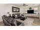 Comfortable living room with leather couches and a large mirror at 3829 S Harlan --, Mesa, AZ 85212
