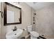 Clean bathroom with a shower, toilet, and a vanity with a mirror at 754 E Kesler Ln, Chandler, AZ 85225