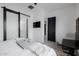 Modern bedroom with ensuite bathroom access and a workspace at 8533 E Avalon Dr, Scottsdale, AZ 85251