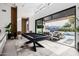 Game room features pool table and opens to patio and pool at 8533 E Avalon Dr, Scottsdale, AZ 85251