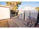 Backyard with shed, concrete patio, and stacked bricks at 937 E 6Th Ave, Mesa, AZ 85204