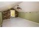 Bright bedroom with ceiling fan and wood accent wall at 937 E 6Th Ave, Mesa, AZ 85204