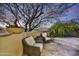 Relaxing patio with seating area, stone flooring, and a beautiful desert mountain view at 10295 E Rising Sun Dr, Scottsdale, AZ 85262