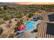 Inviting pool and patio with mountain backdrop at 10432 E Winter Sun Dr, Scottsdale, AZ 85262