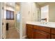 Bathroom with wood cabinets and shower/tub combo at 10432 E Winter Sun Dr, Scottsdale, AZ 85262