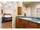 Bathroom with granite countertop and wood cabinets at 10432 E Winter Sun Dr, Scottsdale, AZ 85262
