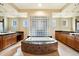 Large bathroom boasts a luxurious soaking tub and double vanity at 10432 E Winter Sun Dr, Scottsdale, AZ 85262