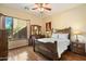 Spacious bedroom with wood flooring and large window at 10432 E Winter Sun Dr, Scottsdale, AZ 85262