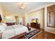 Main bedroom with hardwood floors and access to the bathroom at 10432 E Winter Sun Dr, Scottsdale, AZ 85262