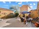 Relaxing courtyard with seating area and shade umbrella at 10432 E Winter Sun Dr, Scottsdale, AZ 85262