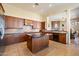 Island kitchen with granite countertops and stainless steel appliances at 10432 E Winter Sun Dr, Scottsdale, AZ 85262