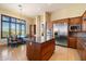 Gourmet kitchen with stainless steel appliances and island at 10432 E Winter Sun Dr, Scottsdale, AZ 85262