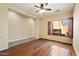 Open living room with wood flooring and ceiling fan at 10432 E Winter Sun Dr, Scottsdale, AZ 85262