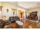Open living space with hardwood floors and leather sofas at 10432 E Winter Sun Dr, Scottsdale, AZ 85262