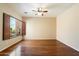 Bright living room featuring wood floors and large window at 10432 E Winter Sun Dr, Scottsdale, AZ 85262