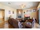 Living room features a stone fireplace and hardwood floors at 10432 E Winter Sun Dr, Scottsdale, AZ 85262