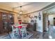 Bright dining area with a red table and chairs and a view into the kitchen at 13416 N Emberwood Dr, Sun City, AZ 85351