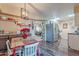 Kitchen features a dining area with a red table and chairs, near the kitchen at 13416 N Emberwood Dr, Sun City, AZ 85351