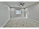 Bright bedroom featuring carpet flooring and window blinds at 14595 S Charco Rd, Arizona City, AZ 85123