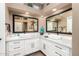 Elegant bathroom with double sinks, large mirrors, and ample storage at 15313 W Blue Verde Dr, Sun City West, AZ 85375