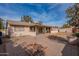 House exterior and backyard with fire pit and patio at 1801 W Marlboro Dr, Chandler, AZ 85224