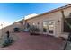 Relaxing backyard patio with seating and grill at 18650 N 91St Ave # 4001, Peoria, AZ 85382