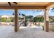 Covered patio with a stone water feature and desert landscaping at 20283 N 273Rd Ave, Buckeye, AZ 85396