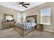 Main bedroom with wood furniture and floral bedding set at 22743 N Diamond Dr, Maricopa, AZ 85138