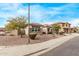 One-story house with brown garage door and stone accents at 2422 W Clearview Trl, Anthem, AZ 85086