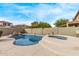 Relaxing backyard pool and spa with a rock waterfall feature at 2422 W Clearview Trl, Anthem, AZ 85086