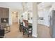 Modern kitchen with a curved island and cowhide stools, fireplace view at 27428 N Covered Wagon N Rd, Phoenix, AZ 85085