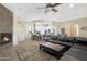 Open living room features a fireplace and flows into the kitchen at 27428 N Covered Wagon N Rd, Phoenix, AZ 85085