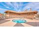 Community hot tub with stone exterior and chairs at 2768 Leisure World --, Mesa, AZ 85206