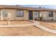 Tan exterior building with a walkway and small landscaping at 3120 N 67Th Ln # 23, Phoenix, AZ 85033