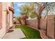 Small backyard with artificial turf and block wall at 3613 W Kathleen Rd, Phoenix, AZ 85053