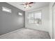 Bedroom featuring gray accent wall and a large window at 3613 W Kathleen Rd, Phoenix, AZ 85053