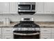 Stainless steel stove and microwave in a modern kitchen at 3751 E Fairmount Ave, Phoenix, AZ 85018