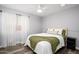 Cozy bedroom with wood floors and ceiling fan at 4636 E Danbury Rd, Phoenix, AZ 85032