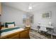 Charming bedroom with wood floors, built-in workspace and ceiling fan at 4636 E Danbury Rd, Phoenix, AZ 85032