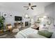 Spacious living room with fireplace, hardwood floors and view of dining area at 4636 E Danbury Rd, Phoenix, AZ 85032
