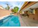Inviting pool area with patio furniture, offering a relaxing outdoor space at 4636 E Danbury Rd, Phoenix, AZ 85032