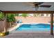 Inviting backyard pool with covered patio and seating area at 4636 E Danbury Rd, Phoenix, AZ 85032
