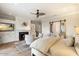 Main bedroom with fireplace, sitting area, and sliding barn door at 5700 E Sanna St, Paradise Valley, AZ 85253