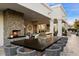 Modern outdoor kitchen, grill, and herringbone fireplace at 5700 E Sanna St, Paradise Valley, AZ 85253