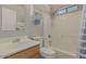 Clean bathroom with a shower/tub combo and wood vanity at 5736 E Lawndale St, Mesa, AZ 85215