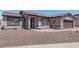 Single-story home with a two-car garage and desert landscaping at 5736 E Lawndale St, Mesa, AZ 85215
