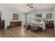 Bright main bedroom with wood floors and a ceiling fan at 5736 E Lawndale St, Mesa, AZ 85215